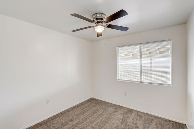 empty room with ceiling fan and carpet