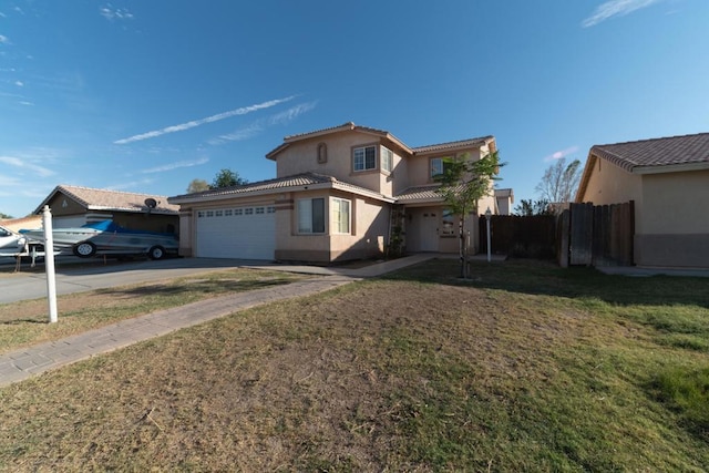 view of front of house featuring a front yard and a garage