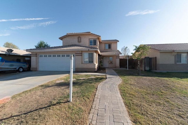 view of front of house with a garage and a front yard