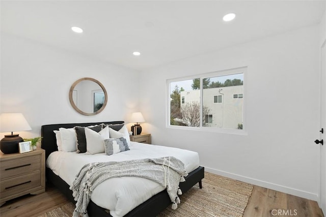 bedroom featuring hardwood / wood-style flooring