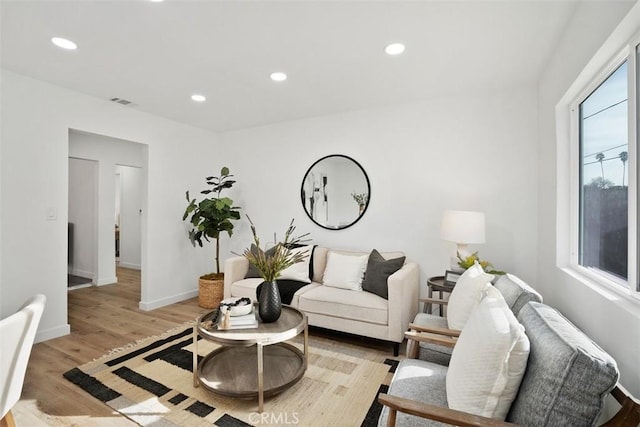 living room with light hardwood / wood-style flooring