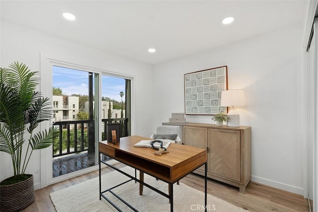 office with light hardwood / wood-style floors