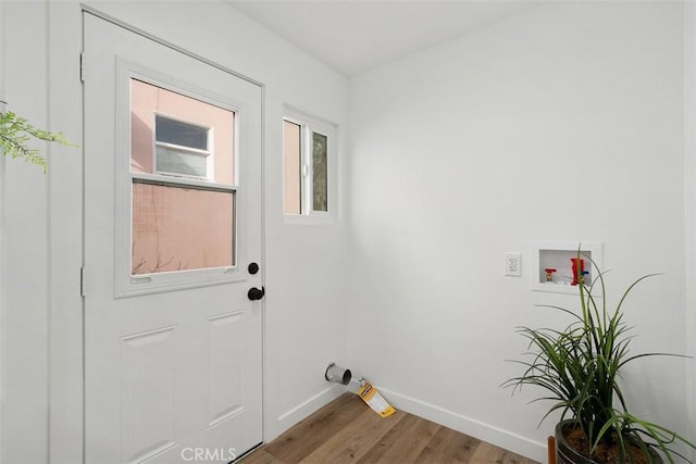 washroom with washer hookup and hardwood / wood-style flooring