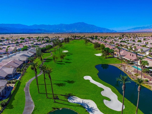 drone / aerial view featuring a water and mountain view