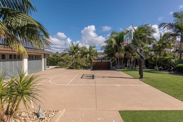 view of basketball court featuring a lawn