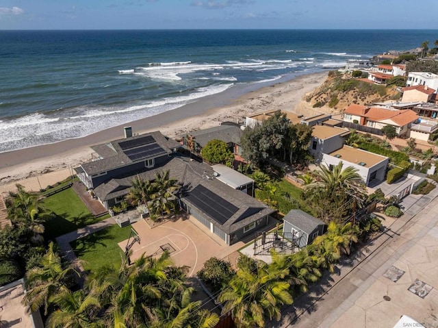 aerial view with a water view and a view of the beach