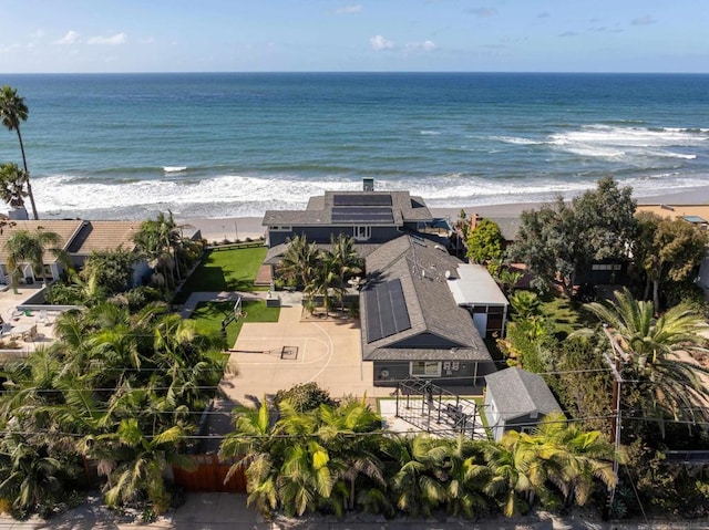 aerial view with a water view and a view of the beach