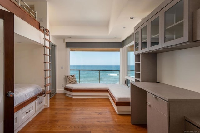 mudroom featuring a water view and light hardwood / wood-style floors