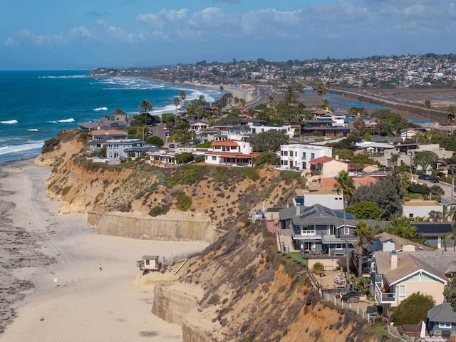 aerial view featuring a water view and a beach view