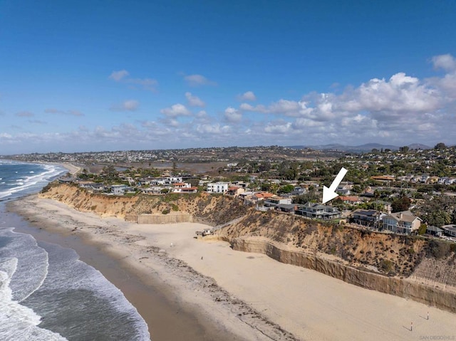 aerial view featuring a view of the beach and a water view