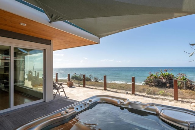 property view of water featuring a beach view