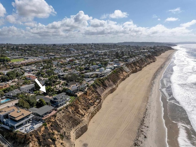 drone / aerial view with a view of the beach and a water view