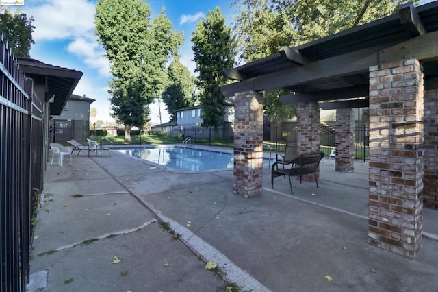 view of swimming pool featuring a patio