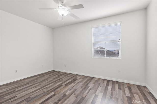 spare room featuring hardwood / wood-style flooring and ceiling fan