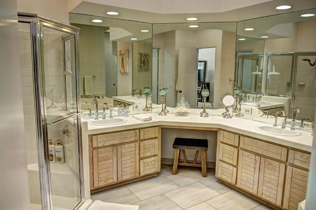 bathroom featuring vanity, tile patterned floors, and walk in shower