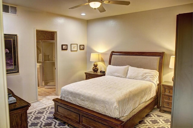 tiled bedroom featuring ceiling fan and ensuite bathroom