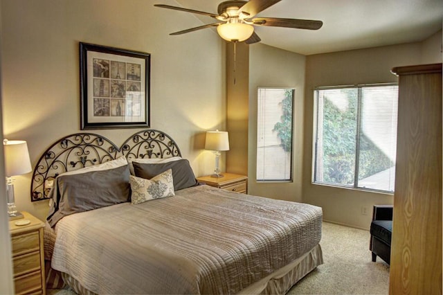 bedroom featuring ceiling fan and light colored carpet