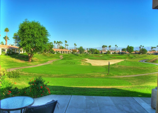 view of property's community with a lawn