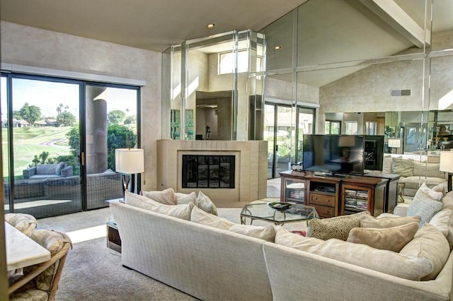 carpeted living room featuring high vaulted ceiling and beam ceiling