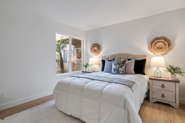 bedroom with light wood-type flooring