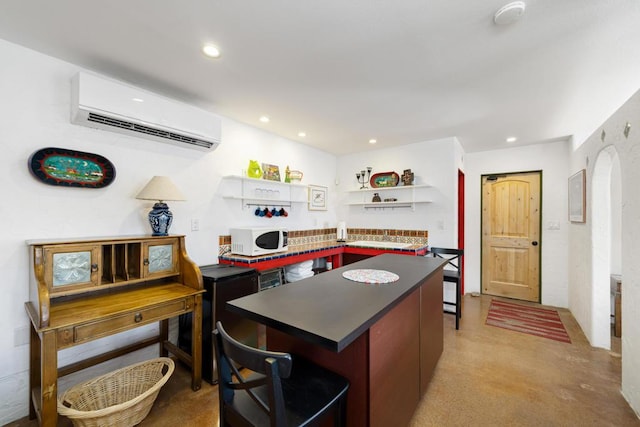 kitchen featuring an AC wall unit