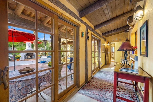 entryway with french doors, vaulted ceiling with beams, and wood ceiling