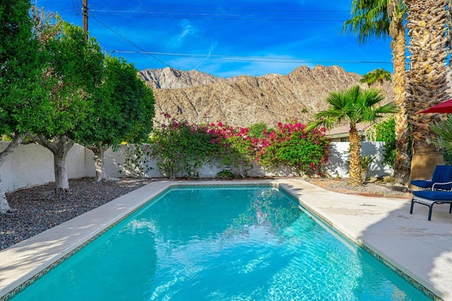 view of swimming pool featuring a mountain view