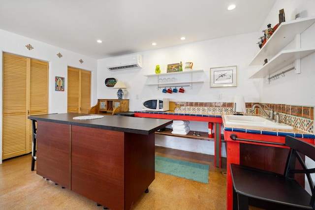 kitchen with decorative backsplash, light colored carpet, a wall unit AC, and sink