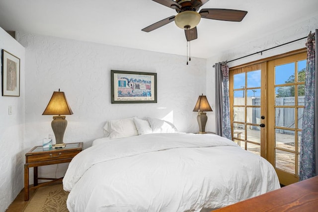 bedroom with french doors and ceiling fan