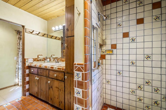 bathroom with tile patterned floors, a shower, vanity, and wooden ceiling