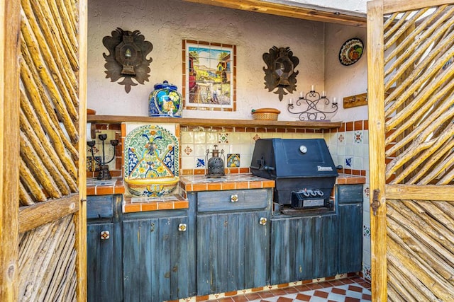 interior space with tile countertops