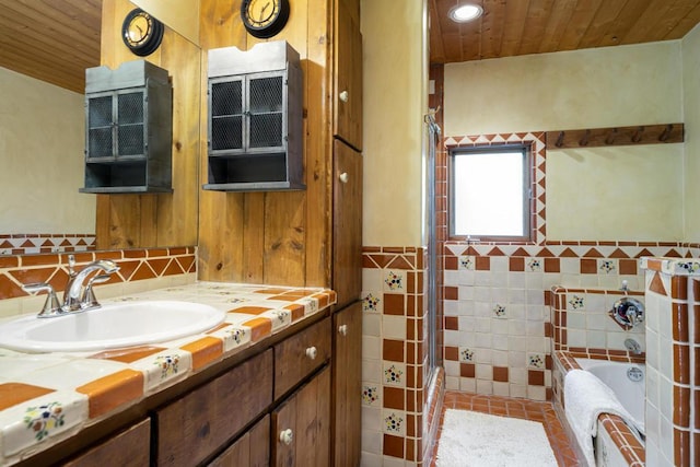 bathroom with a tub, vanity, and wooden ceiling