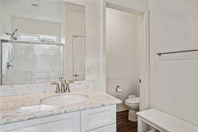 14443 Bottlebrush Way, Moreno Valley, CA 92555 - bathroom featuring toilet, a shower stall, vanity, and wood finished floors