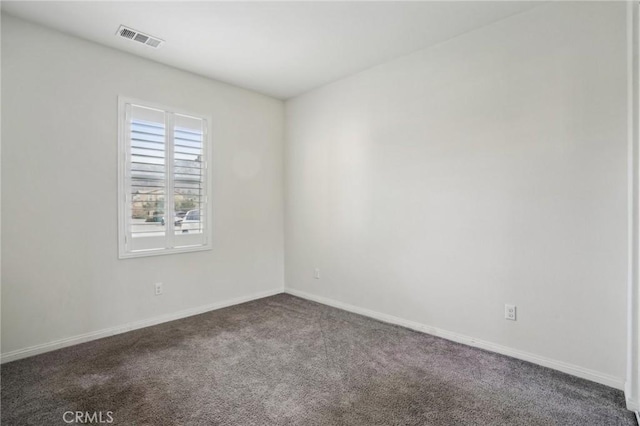 empty room featuring carpet flooring