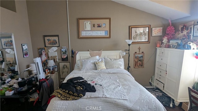 bedroom featuring vaulted ceiling