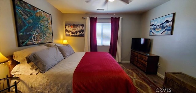 bedroom with ceiling fan and hardwood / wood-style floors