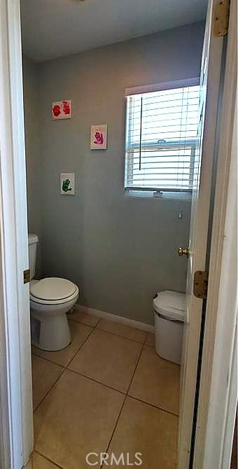 bathroom featuring tile patterned flooring and toilet