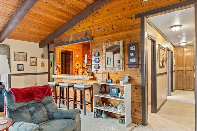24601 Deertrail Dr, Tehachapi, CA 93561 - bar area with light carpet, wood walls, and wood ceiling