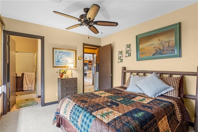 24601 Deertrail Dr, Tehachapi, CA 93561 - carpeted bedroom featuring ensuite bath, ceiling fan, and baseboards