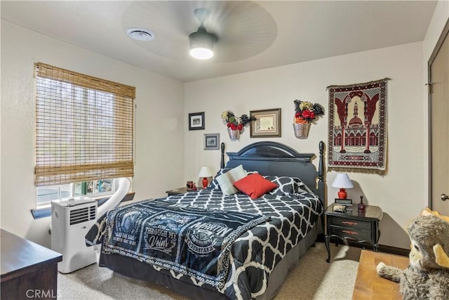 carpeted bedroom featuring ceiling fan