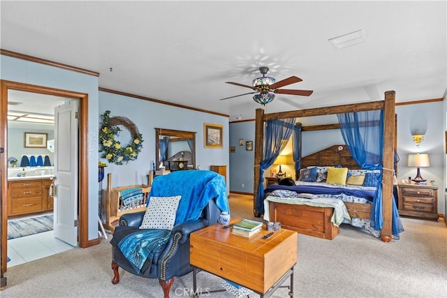 carpeted bedroom with ceiling fan, crown molding, and connected bathroom