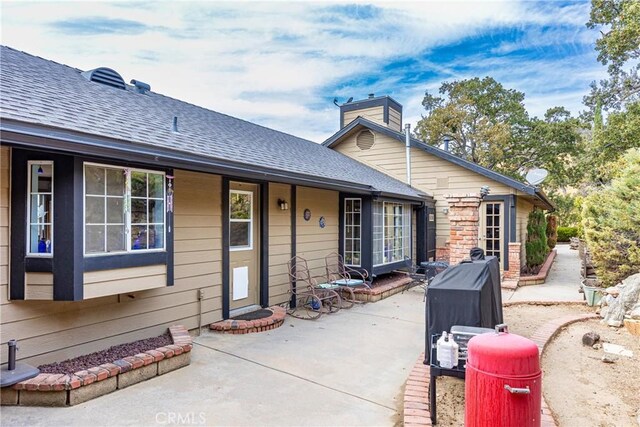 back of property with a patio area