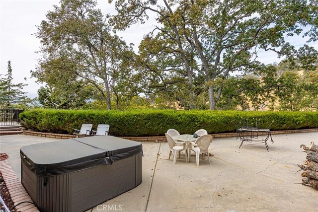 24601 Deertrail Dr, Tehachapi, CA 93561 - view of patio / terrace featuring a hot tub and outdoor dining space