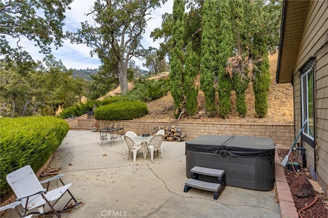 view of patio / terrace featuring a hot tub