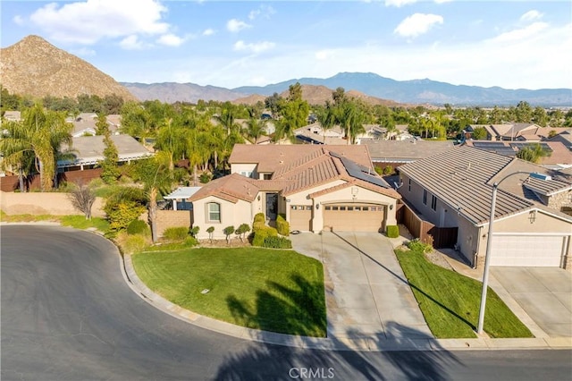 birds eye view of property featuring a mountain view