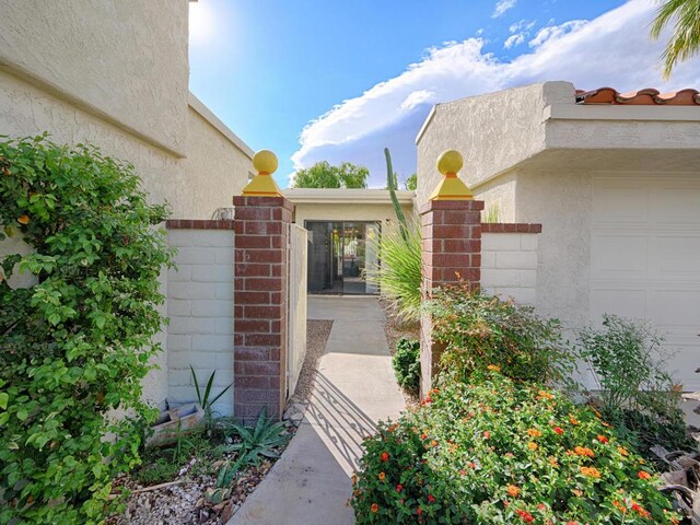 view of exterior entry featuring a garage