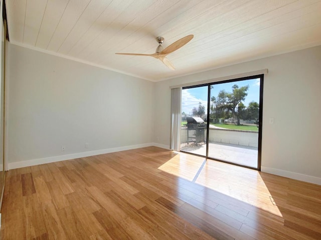 spare room with ceiling fan, ornamental molding, wood ceiling, and light hardwood / wood-style floors