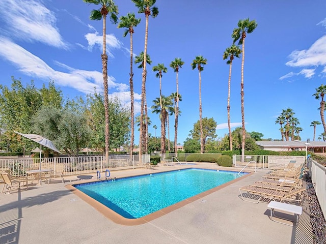 view of swimming pool featuring a patio area