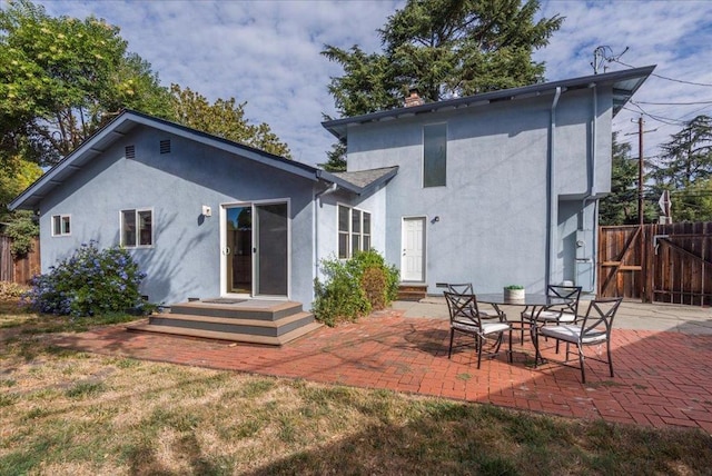 back of house featuring a patio area