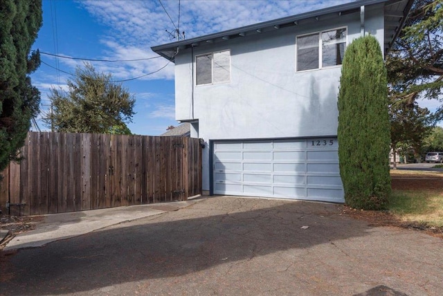 view of side of home with a garage